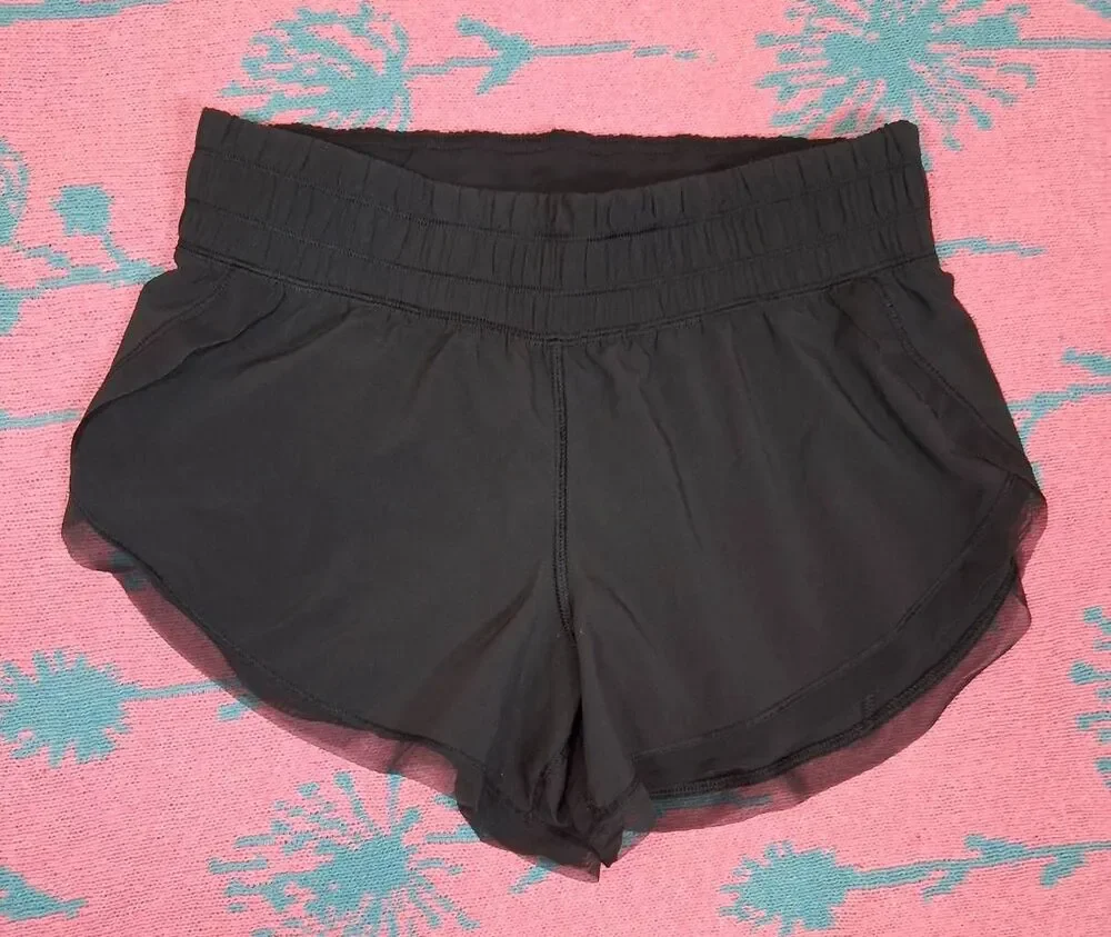 Lululemon womens size 4 mesh hem black running shorts gym Activewear athletic